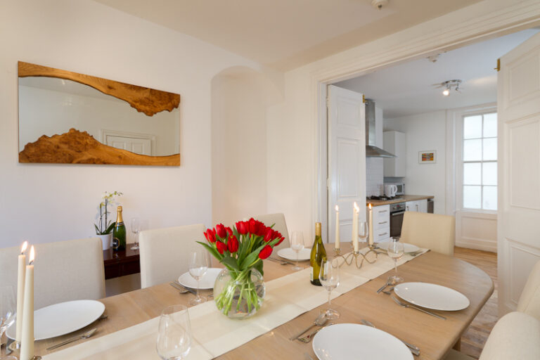 The dining room opening through to the kitchen